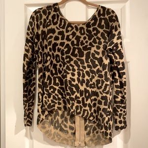 Thin giraffe print high/low crew sweater with back zipper.